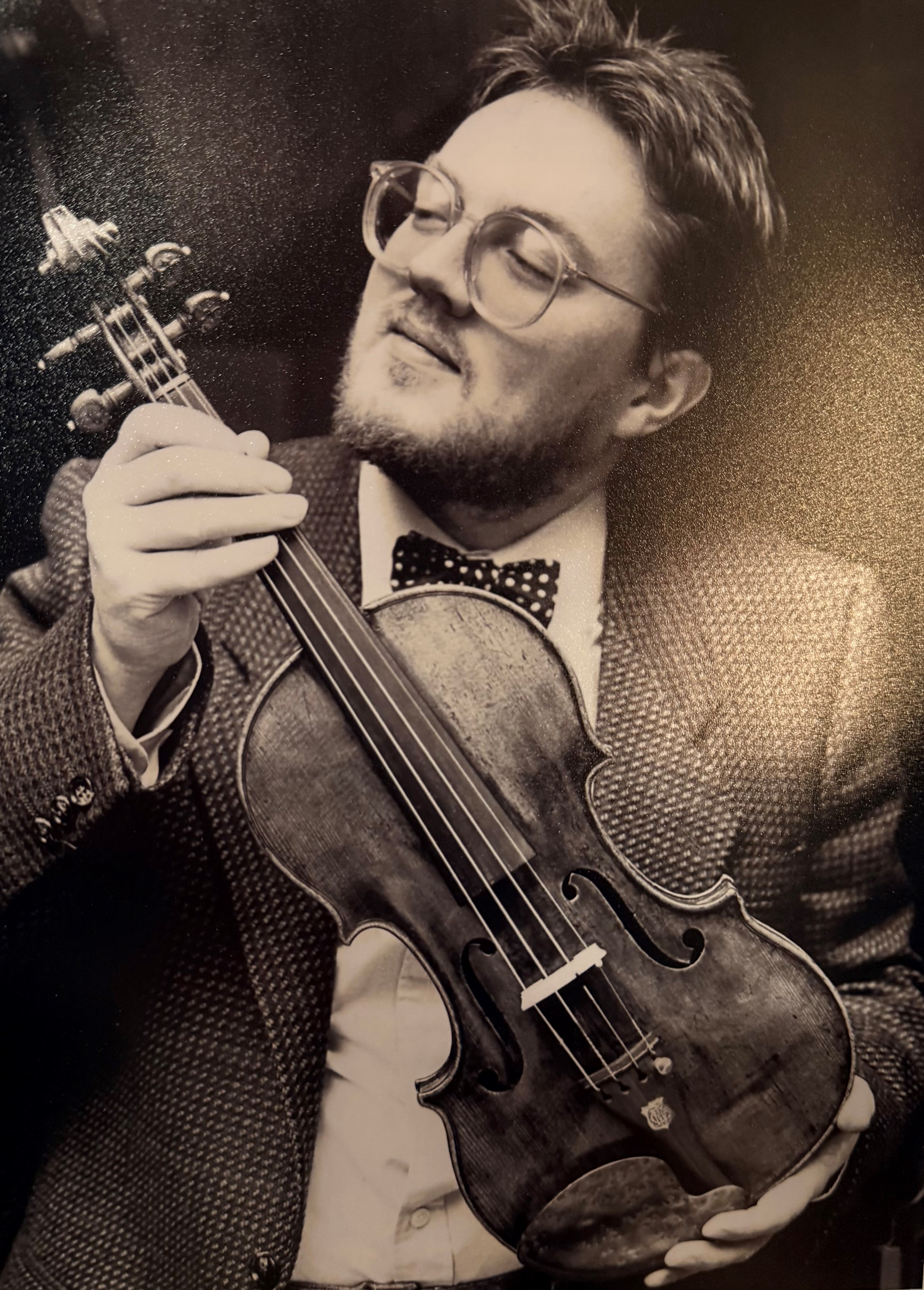 Sotheby's' expert Adam Watson holding La Cathedrale in November 1984